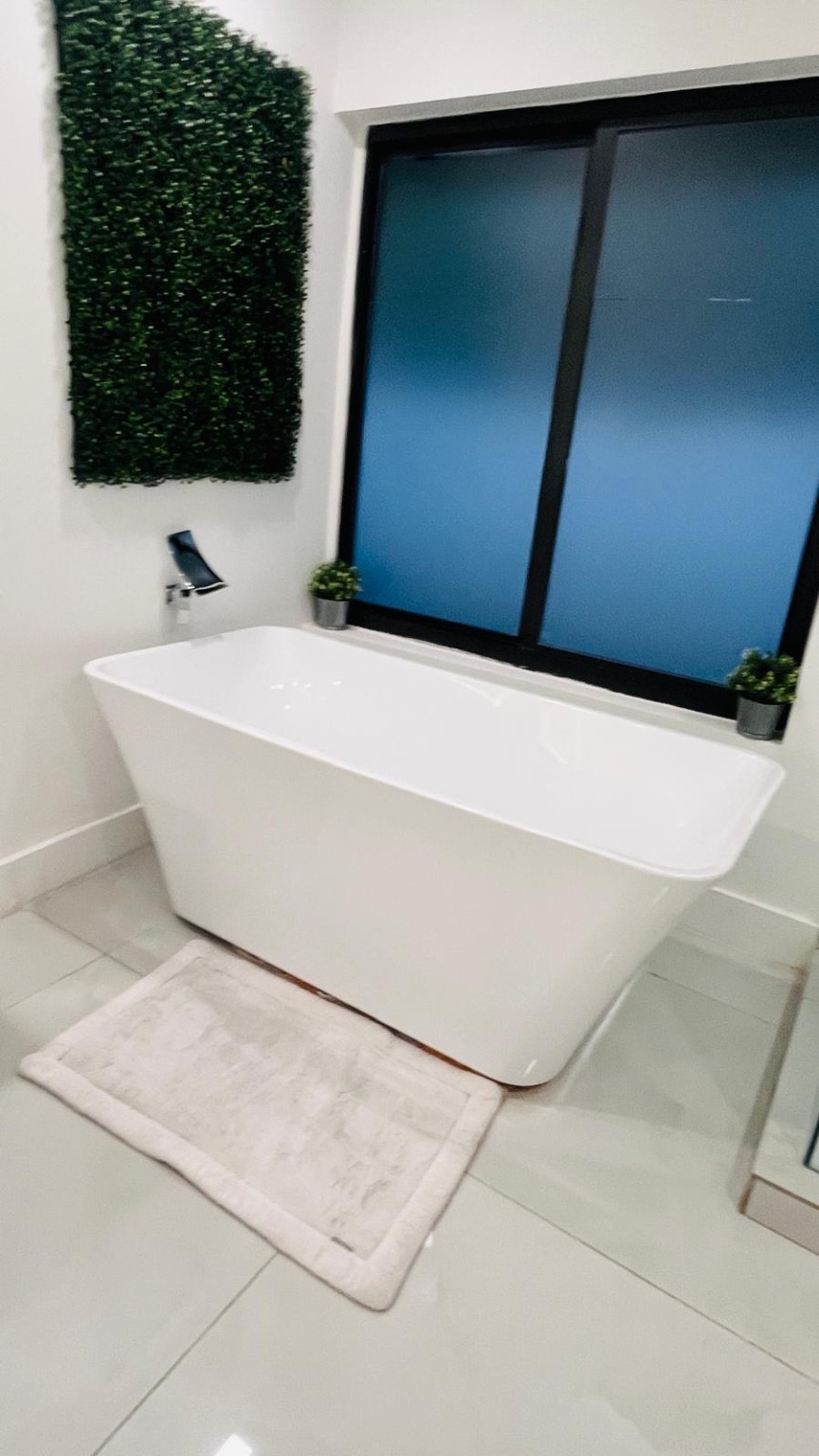 Modern freestanding bathtub in an immaculate finished bathroom